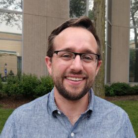 A photo of Jeremy Foote. He is wearing a grey shirt.