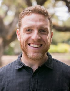 A photo of Aaron Shaw. He is wearing a black shirt.