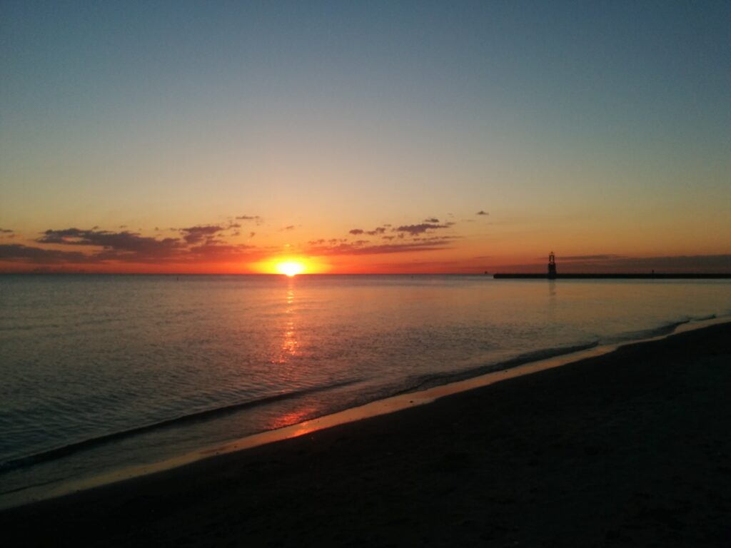 Photo of the sunrise over Lake Michigan taken from a beach in Chicago in 2014.