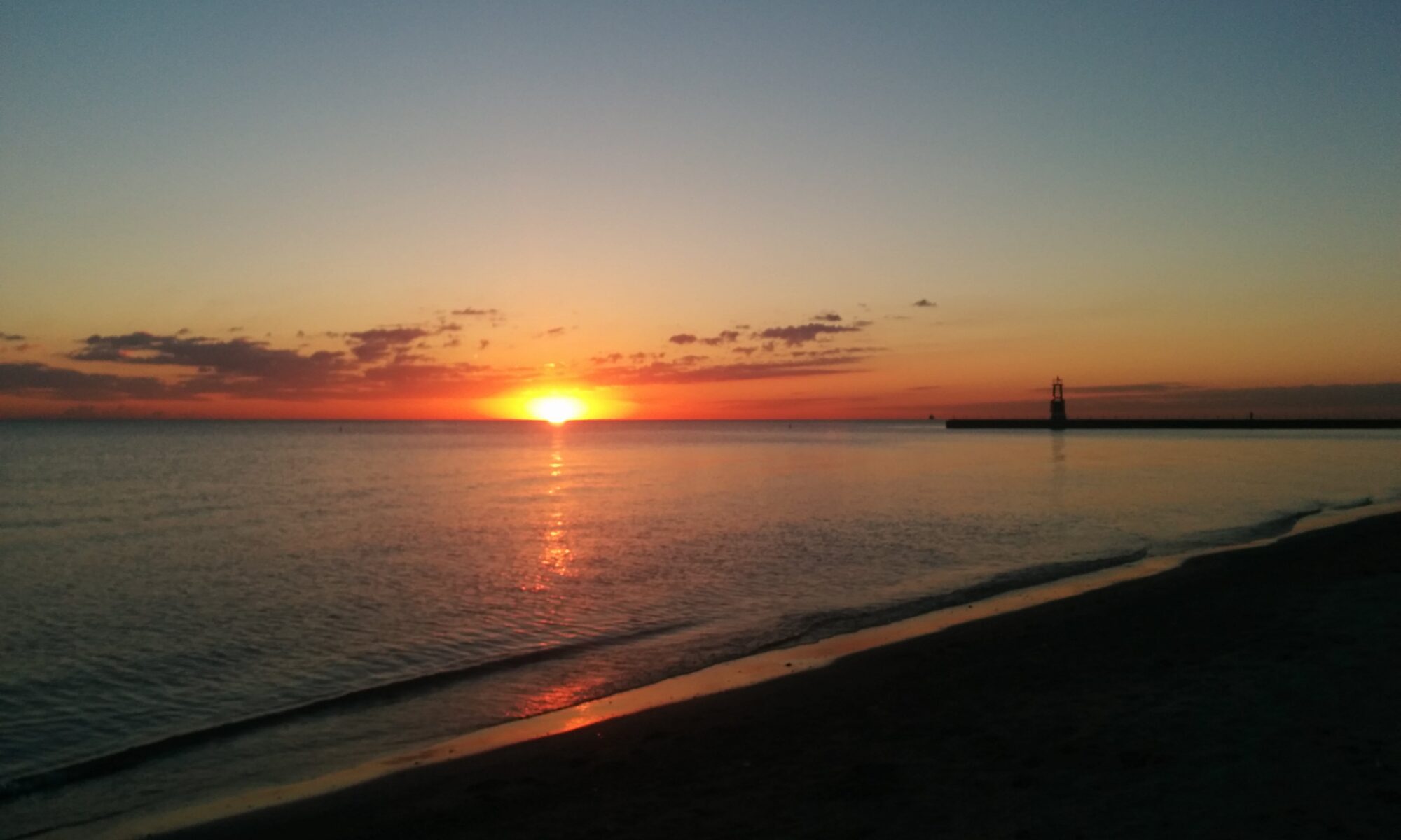 Photo of the sunrise over Lake Michigan taken from a beach in Chicago in 2014.